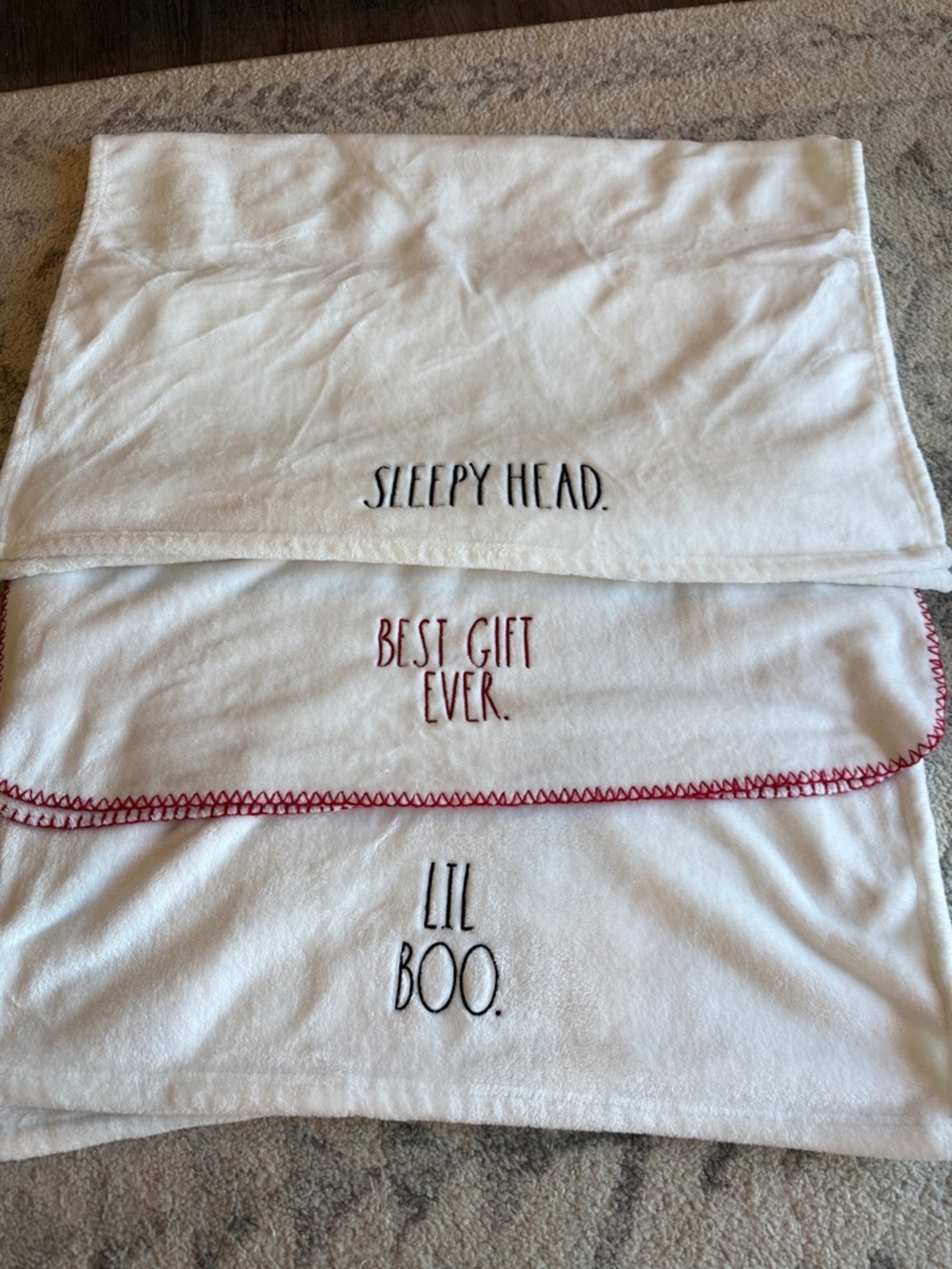 Three Rae Dunn baby blankets